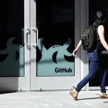 A pedestrian walks past the GitHub Inc. offices in San Francisco, California, United States