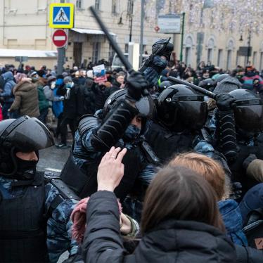 Police officers clash with people during a protest against the jailing of opposition leader Alexei Navalny in Moscow.