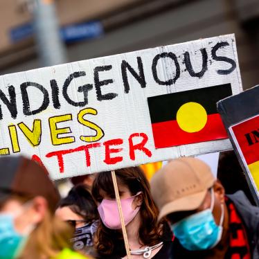 A woman holds an Indigenous Lives Matter placard during a Black Lives Matter rally on June 6, 2020 in Melbourne, Australia.