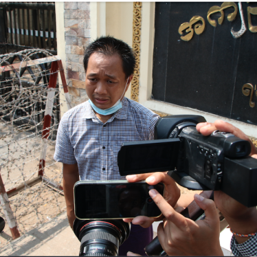 P journalist Thein Zaw talks to reporters outside Insein prison after his release Wednesday, March 24, 2021 in Yangon, Myanmar. 