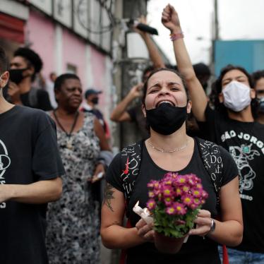 Activists and relatives of victims shout slogans and demand justice the day after a deadly police operation in the Jacarezinho favela of Rio de Janeiro, Brazil, May 7, 2021.