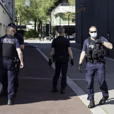 Police agents check identity documents of passerby during the lockdown in Rennes, France. April 11, 2020. 