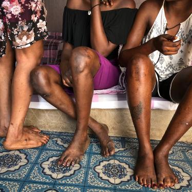 Three sex workers sit at their workplace in Juba, South Sudan on March 5, 2018.