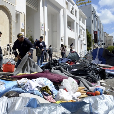 Municipal workers clean a makeshift camp outside the International Organization for Migration office after police forces attempt to evacuate the camp in Tunis, Tunisia, April 11, 2023.