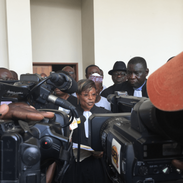 Jacqueline Moudeina speaking to reporters after the reading of the charges