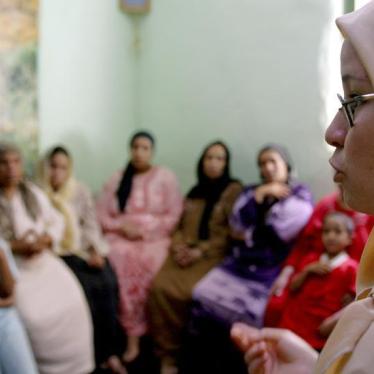 A counsellor talks to a group of women to try to convince them that they should not have Female Genital Mutilation performed on their daughters in Minia, Egypt on June 13, 2006. 