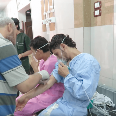 Medical personnel at the al-Quds hospital in Aleppo treat people after a chemical attack on the city on September 6, 2016.