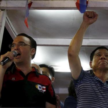 Presidential candidate Rodrigo Duterte raises a clenched fist next to his running mate Vice Presidential candidate Alan Peter Cayetano during an election campaigning for May 2016 national elections in Silang, Cavite southwest of Manila Philippines April 2