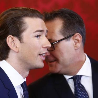Head of the Freedom Party Heinz-Christian Strache (R) and head of the People's Party Sebastian Kurz react during the swearing-in ceremony of the new government in Vienna, December 18, 2017