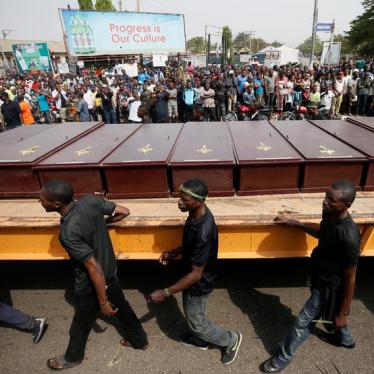 Men march along a truck carrying the coffins of people killed in Makurdi, Nigeria January 11, 2018. 