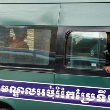 Uon Chhin and Yeang Sothearin, former journalists of the Radio Free Asia (RFA), sit inside a police vehicle as they arrive for a bail hearing at the Appeal Court in Phnom Penh, Cambodia, April 19, 2018. REUTERS/Samrang Pring