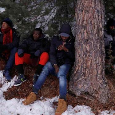 Migrants rest after having crossed part of the Alps mountain range from Italy into France, near the town of Nevache in southeastern France, December 21, 2017.