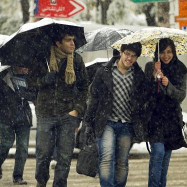 University students cross a street during a snow storm in Tehran November 8, 2010. © 2010 Reuters/Caren Firouz