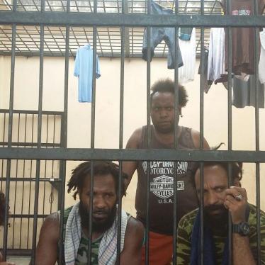 Yanto Awerkion (far left) detained in the Timika police station in September 2017 for his role in organizing a petition calling on the UN to organize a referendum in Papua. 