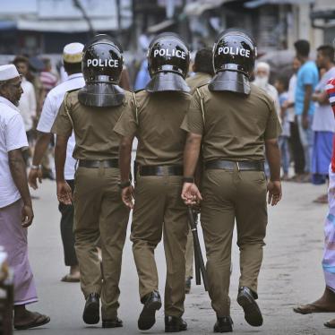 Sri Lankan police officers patrol a Muslim neighborhood after the Easter Sunday bombings, Colombo, April 26, 2019.